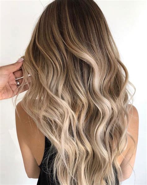 It still creates a striking statement yet chicer and more approachable. . Brown and blonde balayage